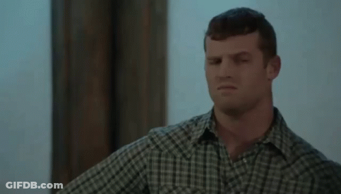 Man In Plaid Shirt Standing GIF