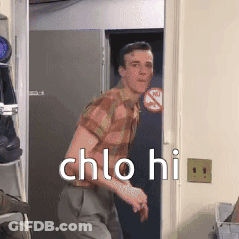 Man In Plaid Shirt Standing In Doorway GIF