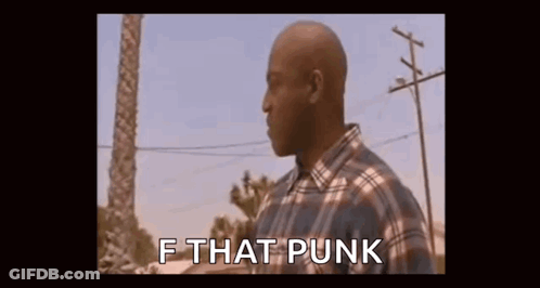 Man In Plaid Shirt Standing In Front Of Palm Tree And Power Line GIF