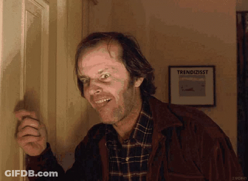 Man In Plaid Shirt Standing In Front Of Trendizisst Sign GIF