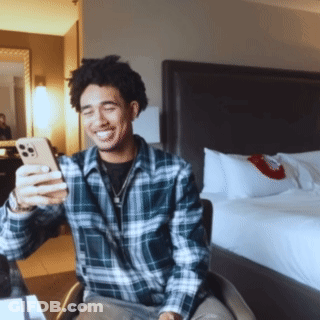 Man In Plaid Shirt Taking Selfie GIF