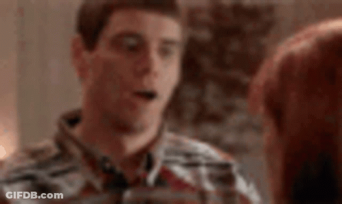 Man In Plaid Shirt Talking On Cell Phone Next To Woman GIF