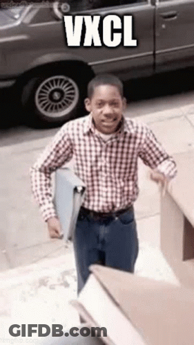 Man In Plaid Shirt Walking Down Sidewalk With Car And Vxcl GIF
