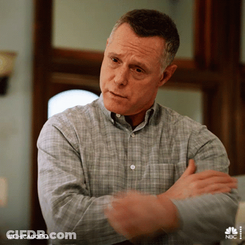 Man In Plaid Shirt With Arms Crossed And #Chicagopd GIF
