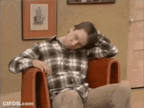 Man In Plaid Shirt With Head In Hands GIF