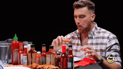 Man In Plaid Shirt With Hot Sauces GIF
