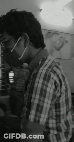 Man In Plaid Shirt With Mask And Glasses GIF