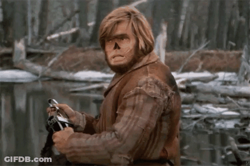 Man In Plaid Shirt With Skull Face GIF