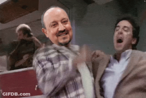 Man In Plaid Smiling, Suited Man Yawning GIF