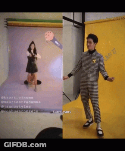 Man In Plaid Suit Next To Woman In Black Dress GIF