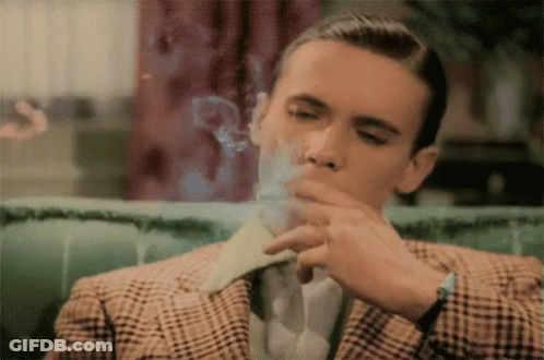 Man In Plaid Suit Smoking Cigarette GIF