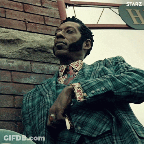 Man In Plaid Suit Smoking Cigarette GIF