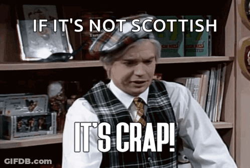 Man In Plaid Vest And Tie Saying If It's Not Scottish It's Crap GIF