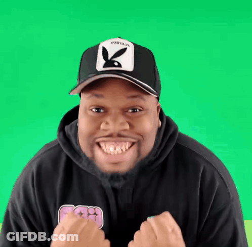 Man In Playboy Hat And Black Hoodie Smiling GIF