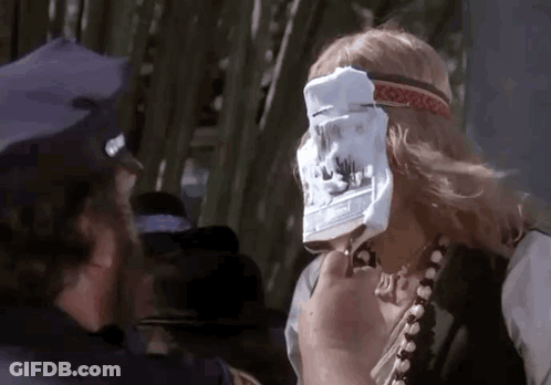 Man In Police Hat Holding Paper To Face GIF