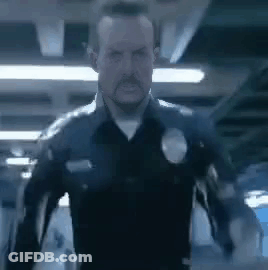 Man In Police Uniform Standing GIF