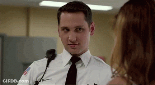 Man In Police Uniform Talking To Woman GIF