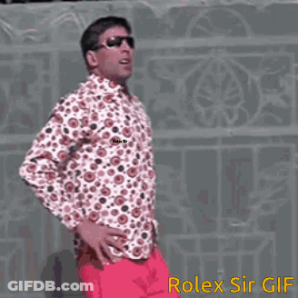 Man In Polka Dot Shirt And Pink Pants With Hands On Hips Rolex Sir GIF