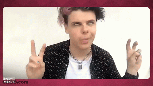 Man In Polka Dot Shirt Giving Peace Sign GIF