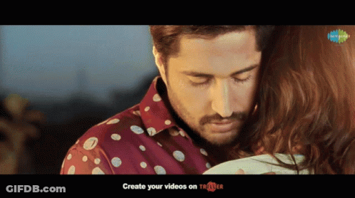 Man In Polka Dot Shirt Holding Woman GIF