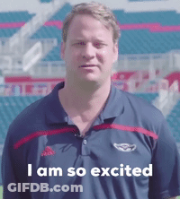 Man In Polo Shirt Says I Am So Excited In Front Of Stadium GIF