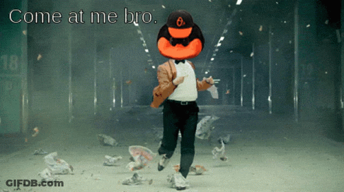 Man In Powell 26 Jersey Next To Mascot GIF