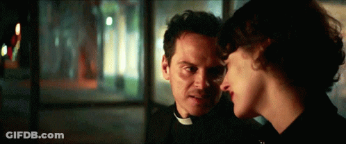 Man In Priest Collar And Woman Looking At Each Other GIF