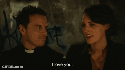 Man In Priest Collar Looking At Another Man GIF
