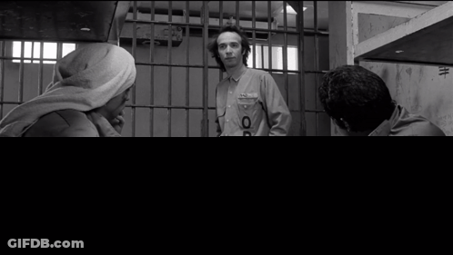 Man In Prison Uniform With OP Letter GIF