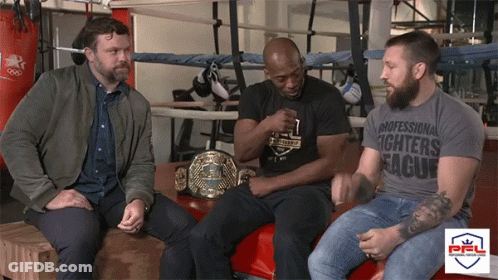 Man In Professional Fighters League T-Shirt With Two Men GIF