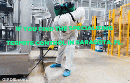 Man In Protective Suit Spraying Floor GIF