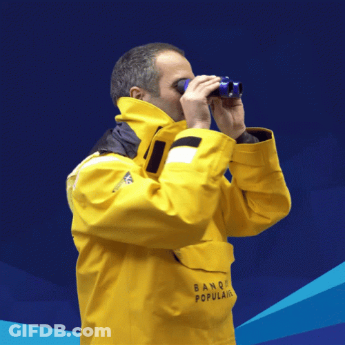 Man In Protective Suit Using Binoculars GIF
