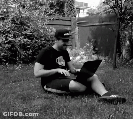 Man In Puma Hat Using Laptop GIF