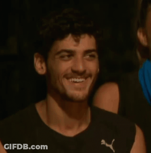 Man In Puma Shirt Sitting Next To Woman GIF