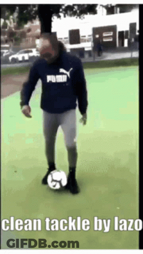 Man In Puma Sweatshirt Kicking Soccer Ball GIF