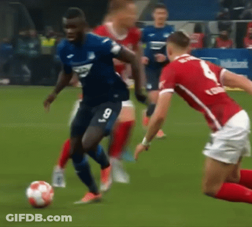 Man In Puma Sweatshirt Kicking Soccer Ball On Field GIF