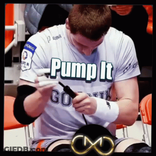 Man In Pump It Shirt Sitting In Chair GIF