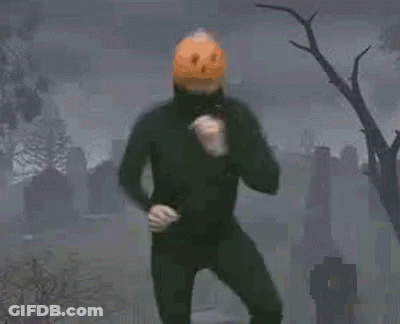 Man In Pumpkin Mask Dancing In Cemetery GIF