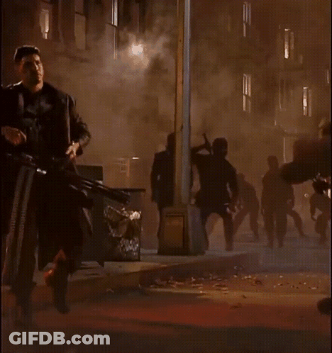 Man In Punisher Costume Holding Gun GIF
