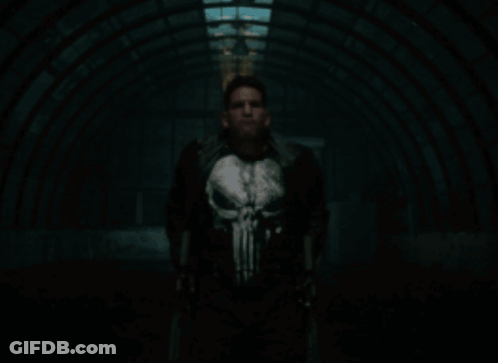 Man In Punisher Costume Holding Guns GIF
