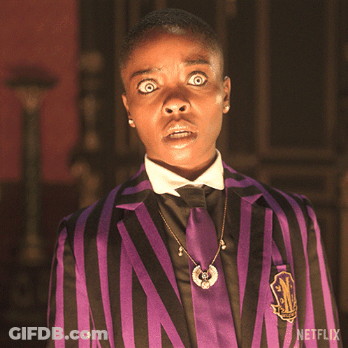 Man In Purple And Black Striped Suit With Netflix Logo GIF