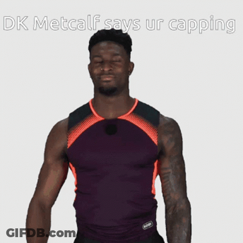 Man In Purple And Orange Shirt Says DK Metcalf Says Ur Capping GIF