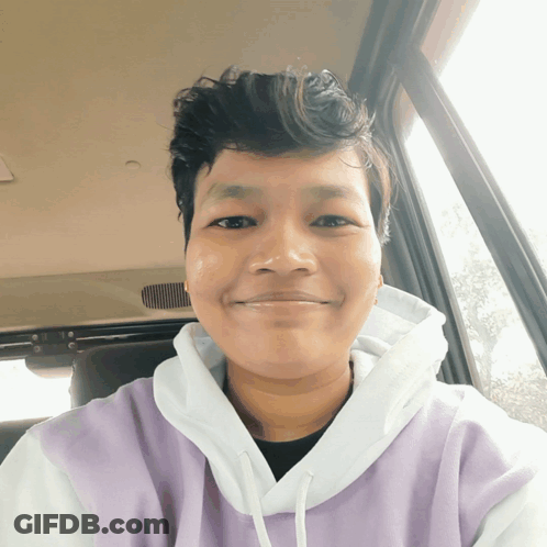 Man In Purple And White Hoodie Smiling GIF
