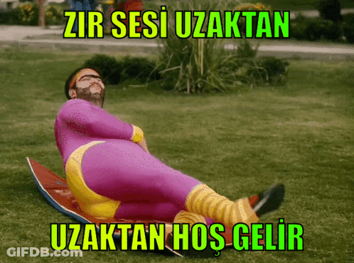 Man In Purple And Yellow Suit On Surfboard Zir Sesi Uzaktan Uzaktan Hos Gelir GIF