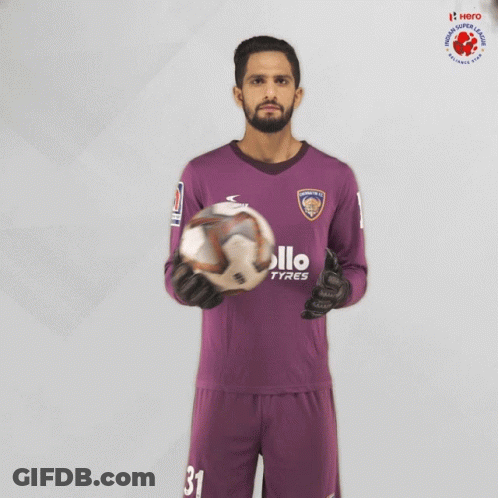Man In Purple Apollo Tyres Jersey Holding Soccer Ball GIF