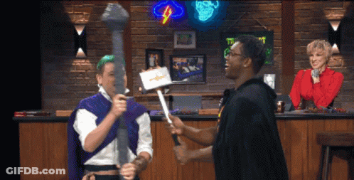 Man In Purple Cape Holding Sword GIF