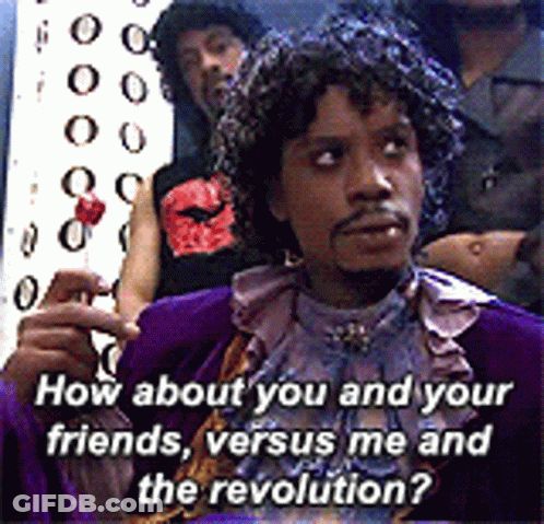 Man In Purple Costume Holding Lollipop Asking How About You And Your Friends Versus Me And The Revolution GIF