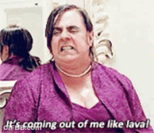 Man In Purple Dress Saying It's Coming Out Like Lava GIF