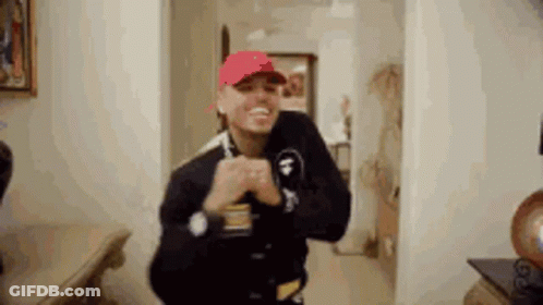 Man In Purple Hat Playing Video Game GIF