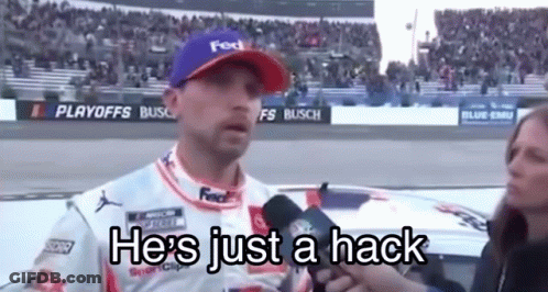 Man In Purple Hat Talking Into Microphone Woman Behind GIF